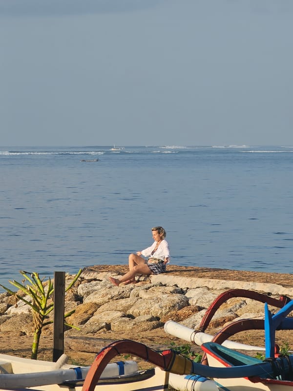 Denpasar coastline: jukung boats, beach cafes, and sea traffic