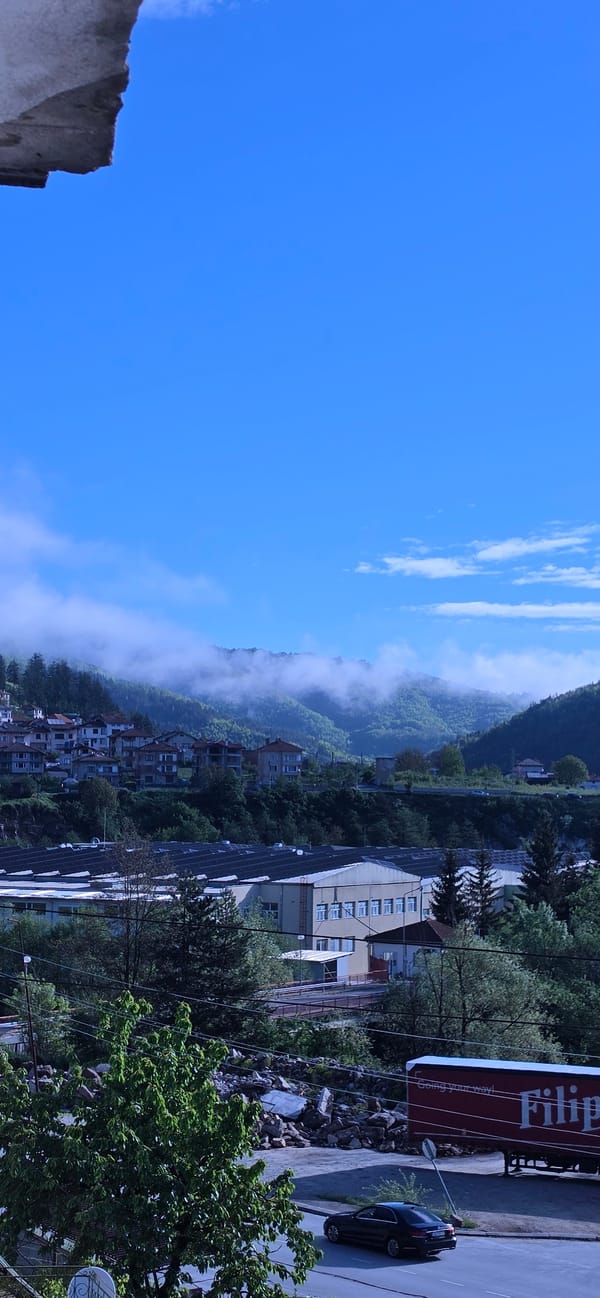 Morning fog shrouds mountains in Rudozem, Bulgaria