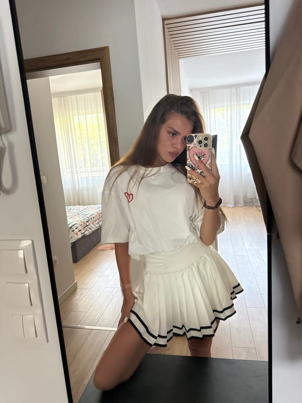 Mirror selfie session in a Plovdiv bedroom, white outfit