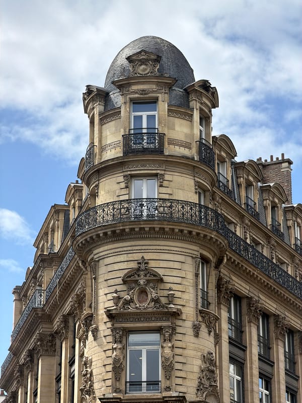 Ordinary Paris moments: architecture, crosswalk, indoor smartphone use documented