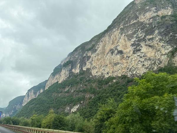 Mountainside view captured from vehicle in Trento, Italy