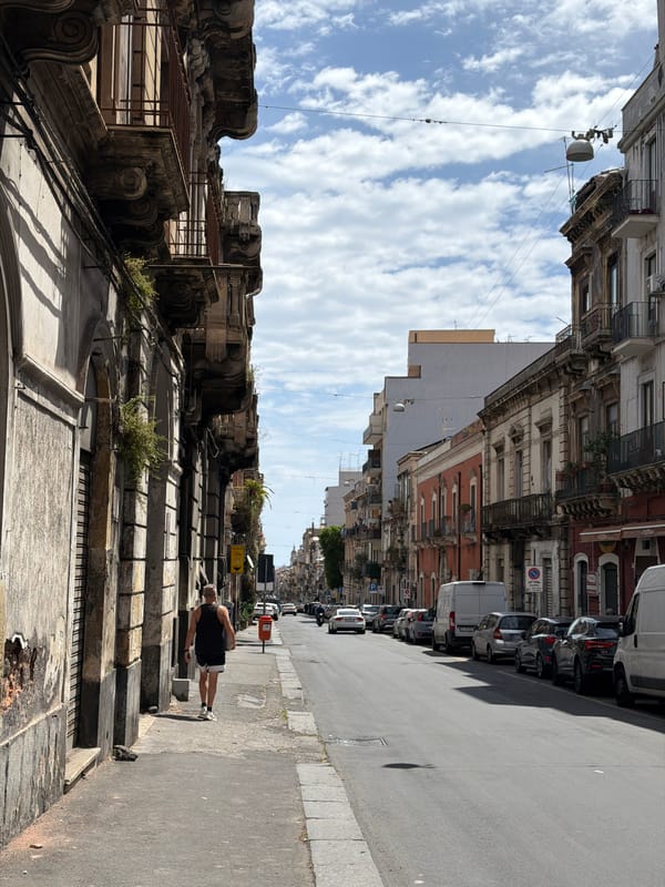 Morning pedestrian activity captured on Catania street