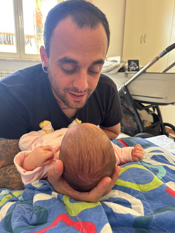 Father bonds with newborn baby in Italian home
