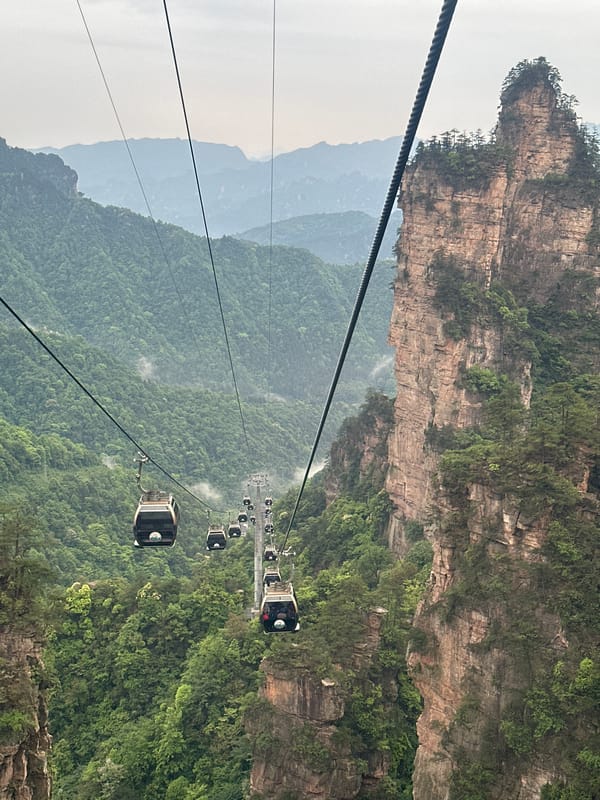 Tourist captures mountain views from Tianzi cable car, Zhangjiajie
