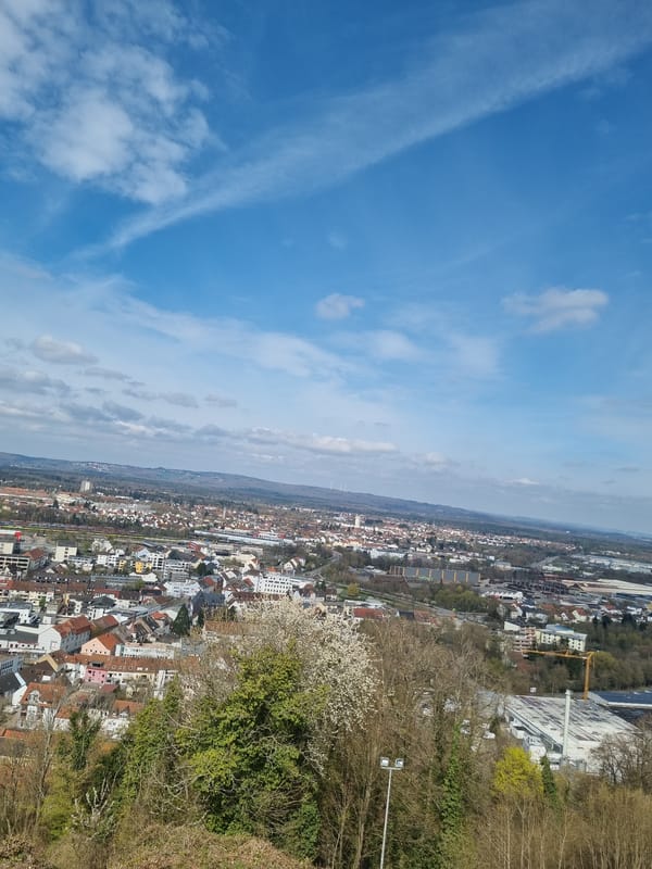 Visitors explore historic Schlossberg Caves and overlooks in Homburg