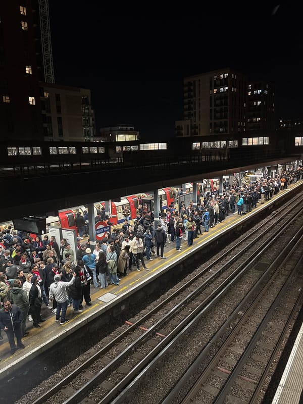 Crowded London Underground platform captured during evening rush