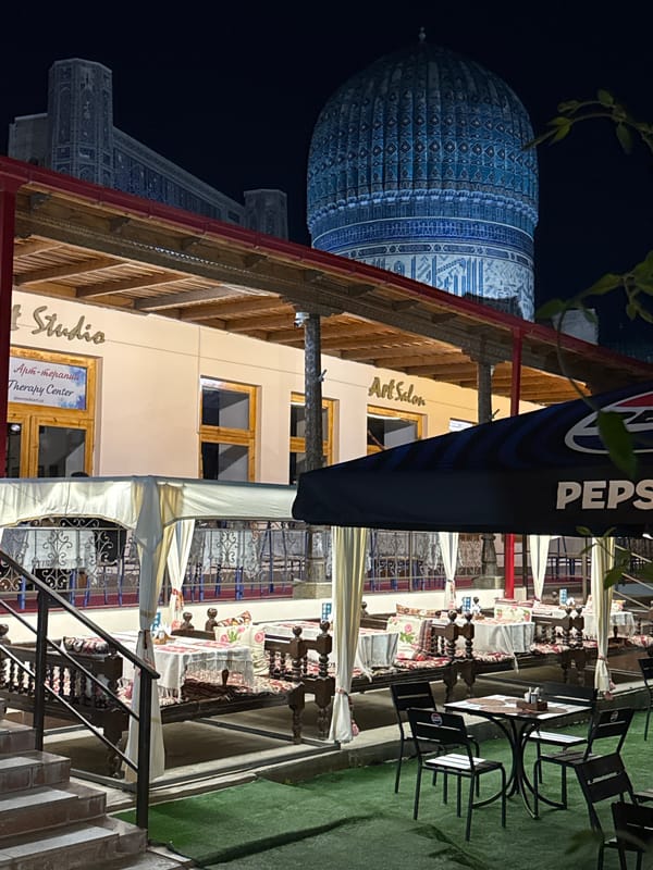 Tourist moments captured near historic Samarkand mausoleum, art salon