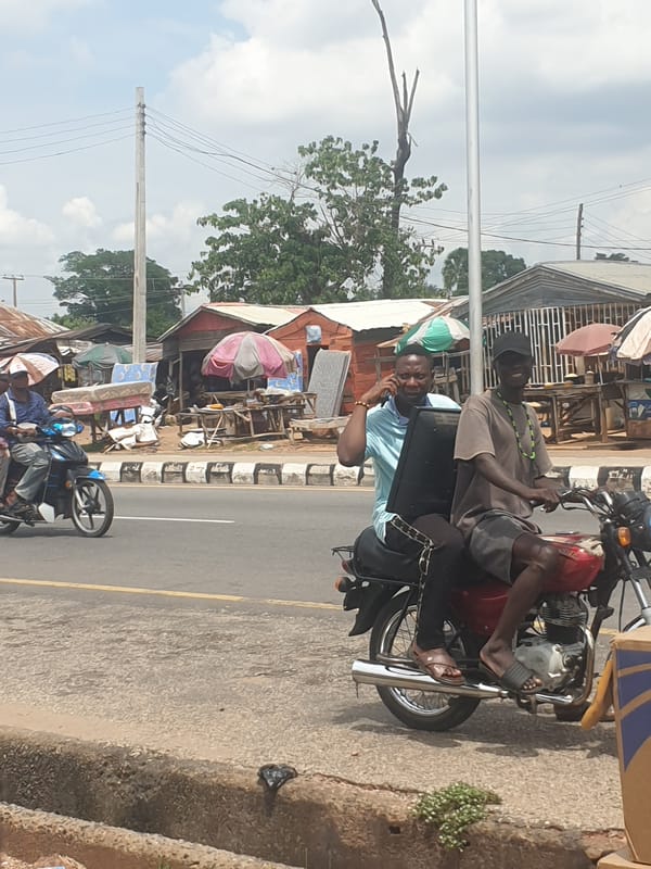 Urban street scene with motorcycles, construction equipment observed