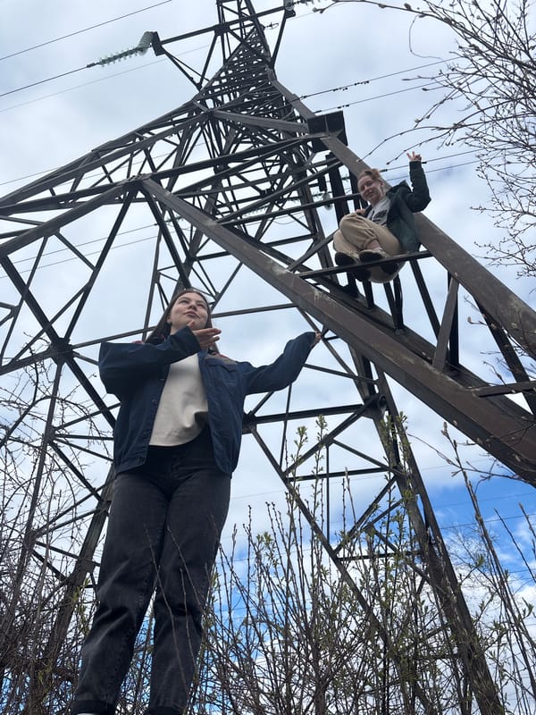 Group gathers for outdoor meal, tower climbing in Chaikovsky