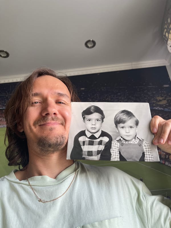 Man displays vintage photos and running medals collection