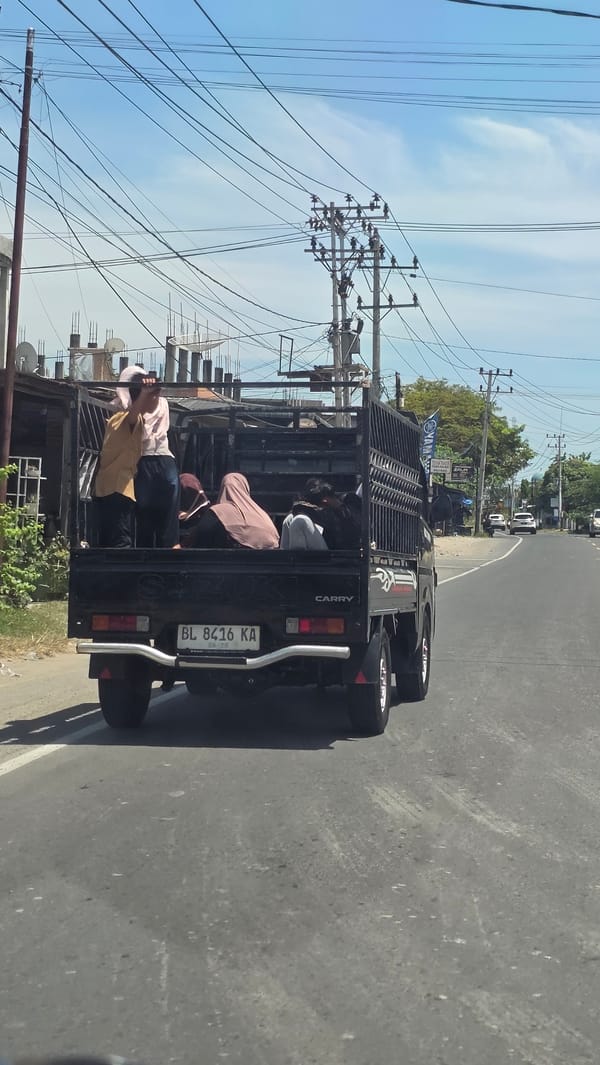 Pickup truck carries passengers in Cotgadong, Indonesia