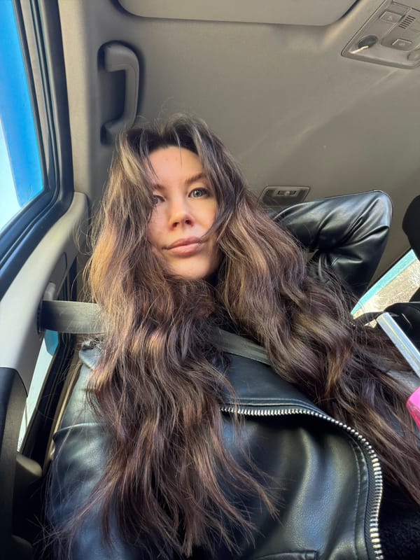 Woman photographed in car passenger seat in Perm