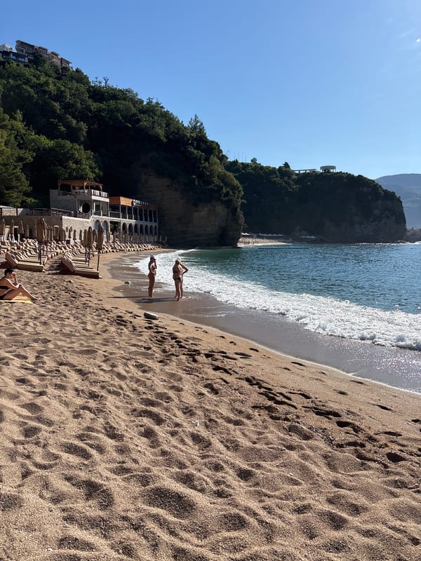 Calm beach morning, empty chairs and rolling waves