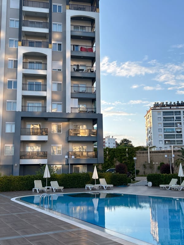 Poolside scene captured at modern building in Alanya, Turkey