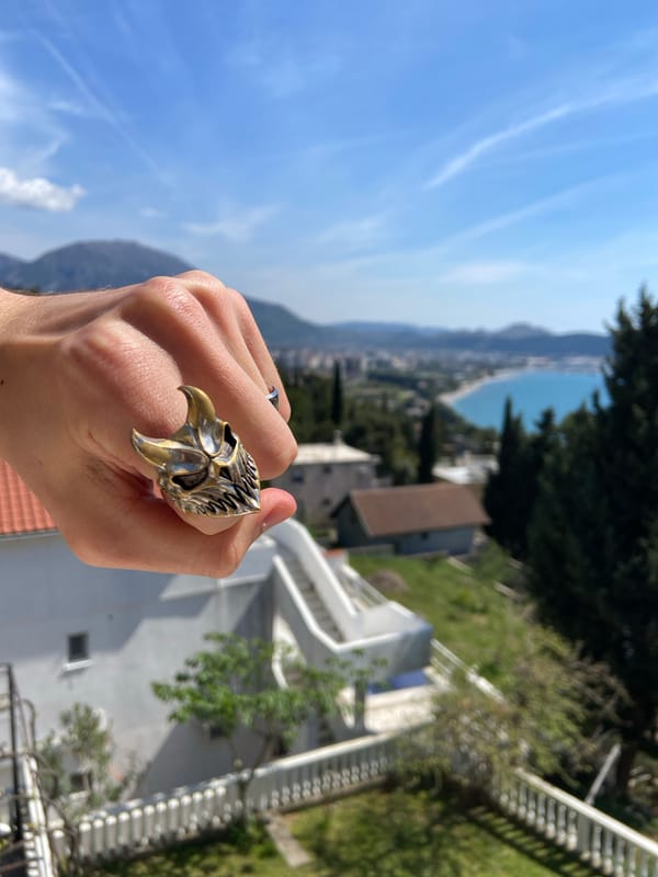 Man takes selfies on balcony in Šušanj, Montenegro
