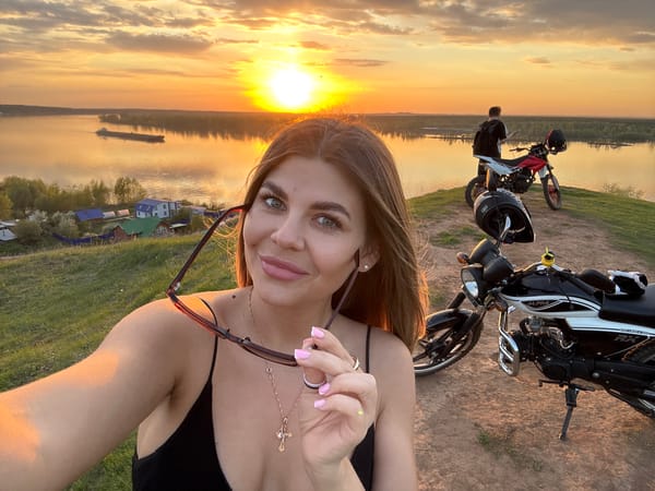 Sunset gathering with motorcycles, selfies captured in Ольховka, Russia