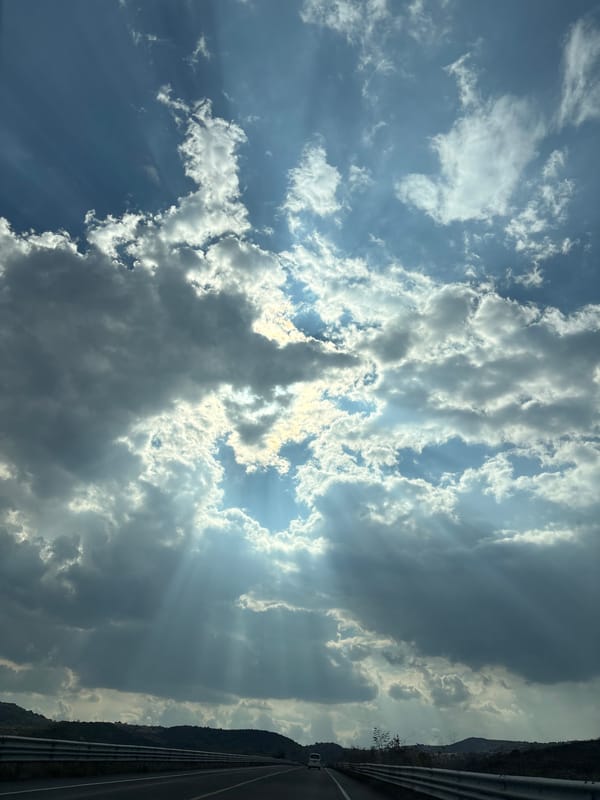 Sunlight breaks through clouds over Santiago Atzitzihuacán, Mexico