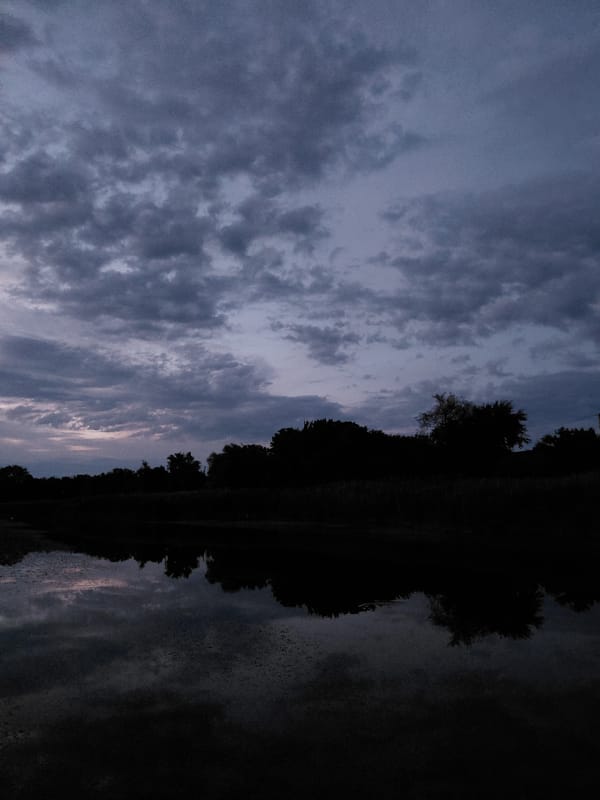 Evening bike ride through quiet rural landscape at dusk