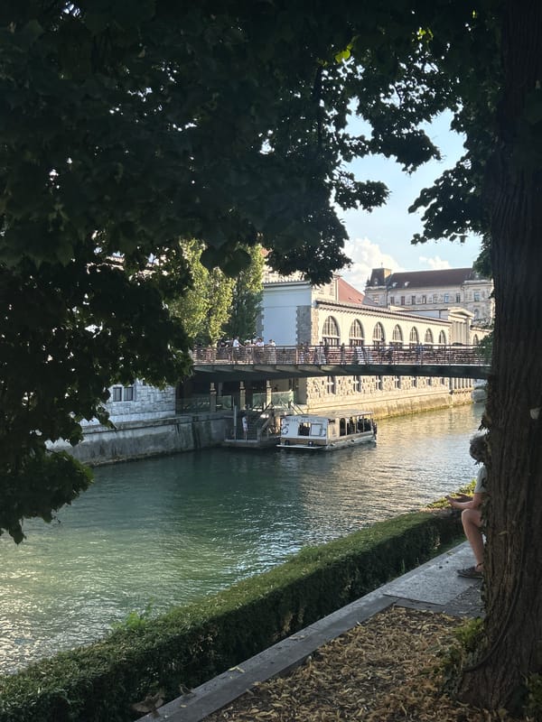Canal boats, cobblestones, and a castle on the hill
