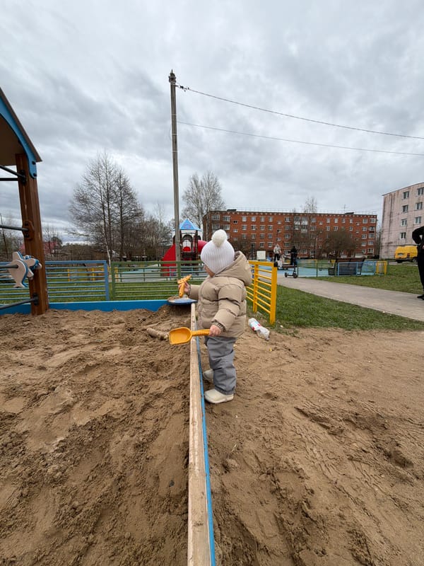 Mother and child enjoy playground time in Reshetnikovo