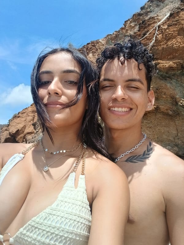 Couple documents beach day with photos in Juan Griego