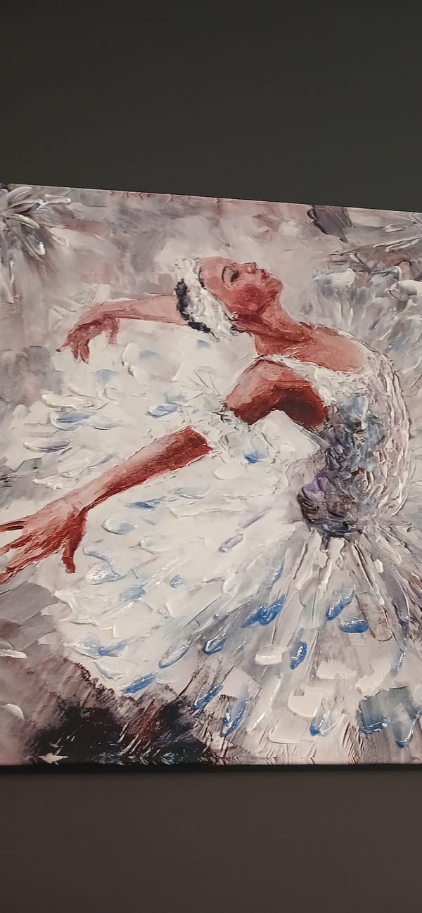 Ballerina painting in white tutu, arms extended mid-pose