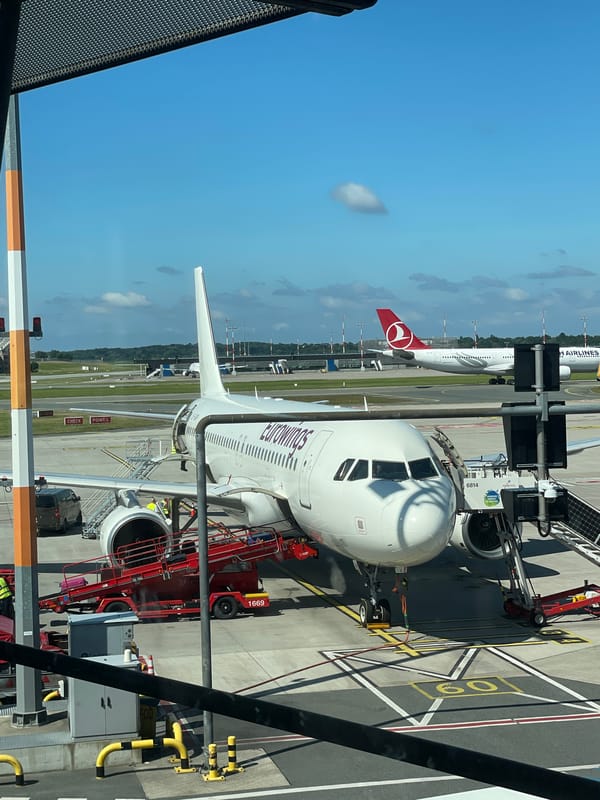 Eurowings and Swiss aircraft parked at Hamburg Airport gates