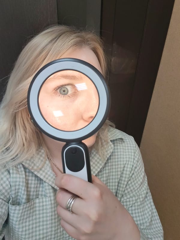 Woman experiments with magnifying glasses, ring lights in Izhevsk