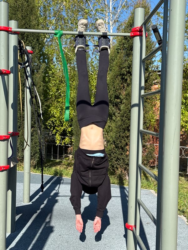 Morning inversion workout captured at Shchelkino outdoor fitness area