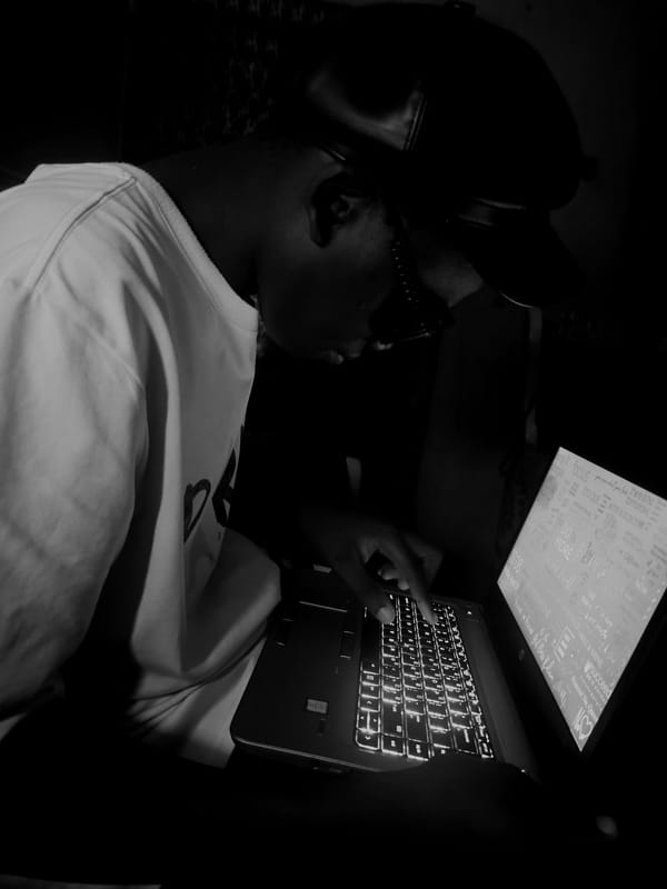 Person uses laptop, pours liquid overhead in Asaba residence