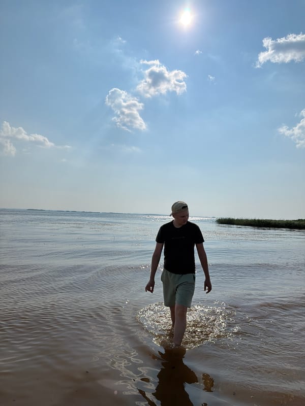 Lazy afternoon boating and wading on a Krasnyi Bor waterway.