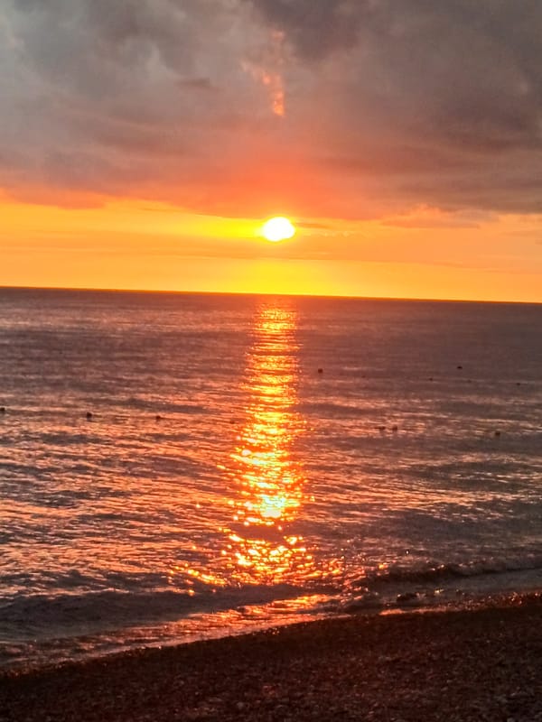 Golden sunset over the Black Sea, Sochi pebble beach