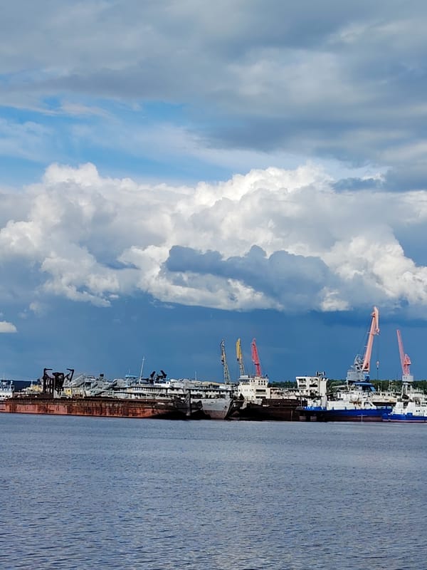 Afternoon waterfront activity documented in Chaikovsky, Russia harbor