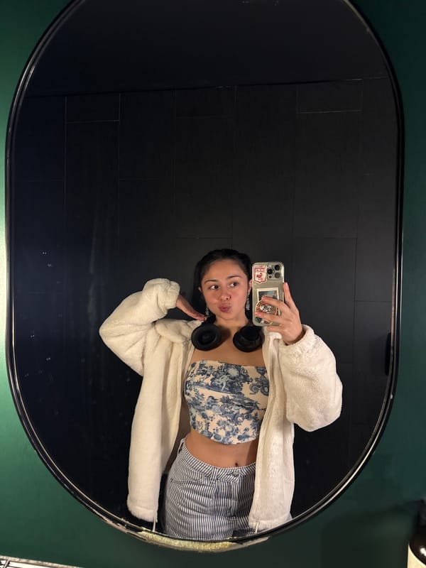 Person takes multiple mirror selfies in decorated Perth building