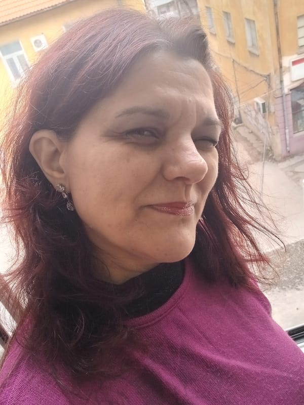 Woman in magenta sweater photographed in Vratsa, Bulgaria