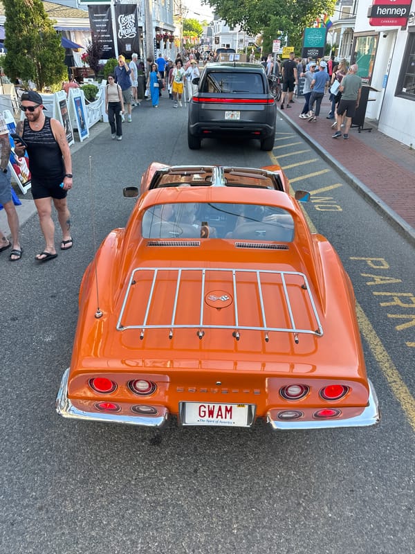 Vintage orange Corvette parked on a Provincetown street