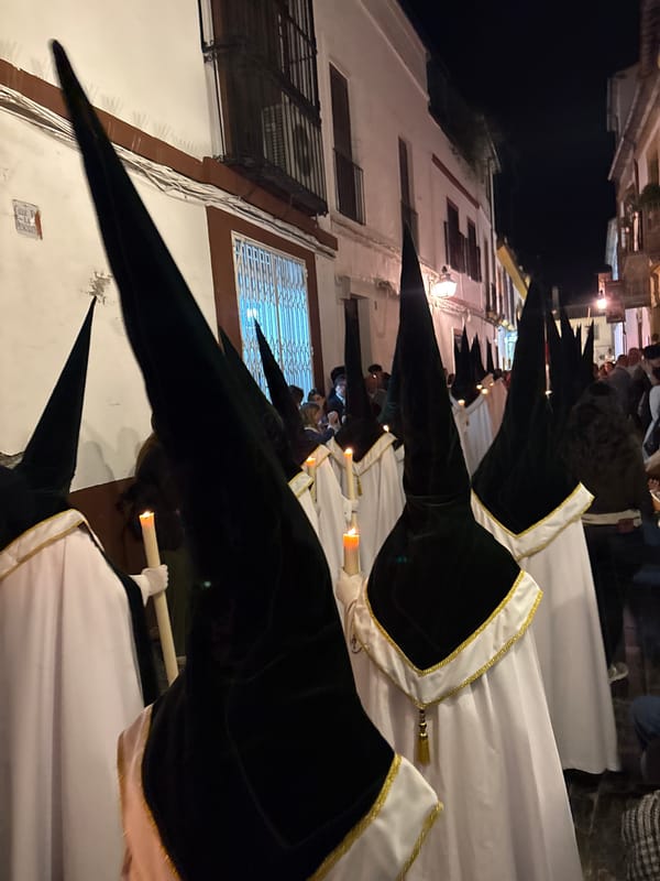 Religious procession with ornate floats winds through Córdoba streets