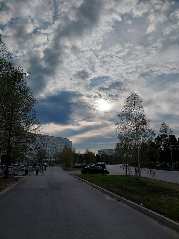 Dramatic sky observed over Nadym street scene