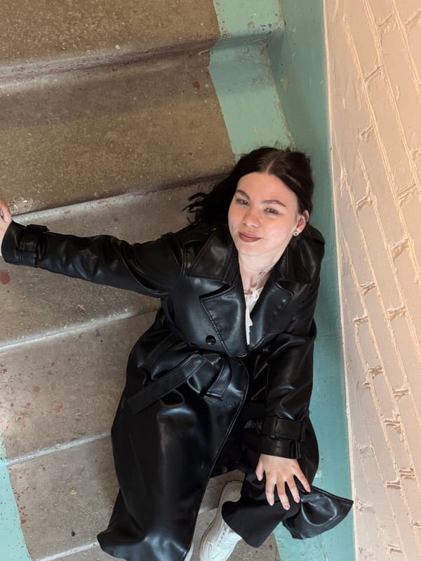Woman rests on concrete stairs in Perm, Russia