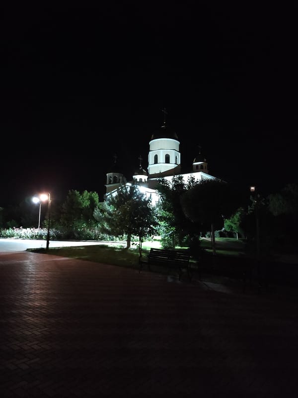 Historic buildings photographed under nighttime illumination during evening hours
