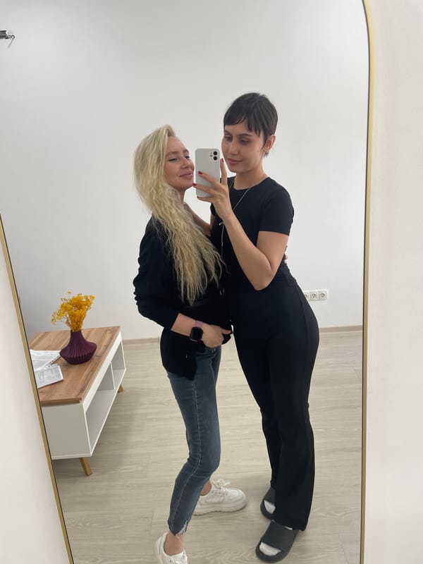 Two women pose for photos together in Izhevsk