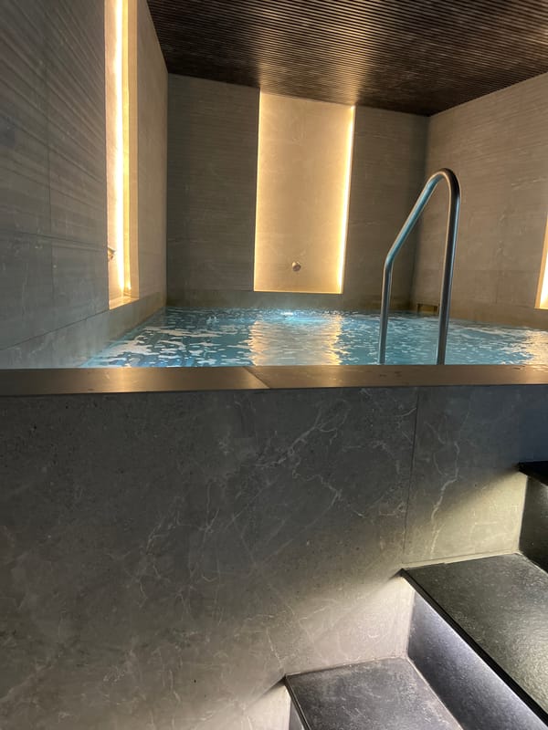 Upscale spa interior with sauna, hot tub, and fireplace in Plovdiv