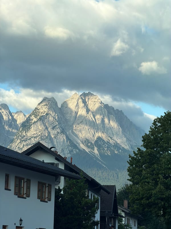 Zugspitze peaks rise above Bavarian village houses in Garmisch-Partenkirchen