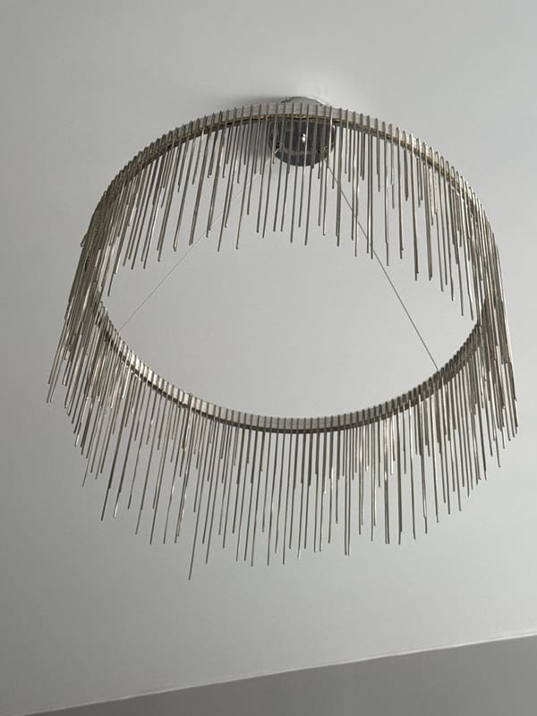 Metal ring sculpture documented on wall in Krasnoyarsk