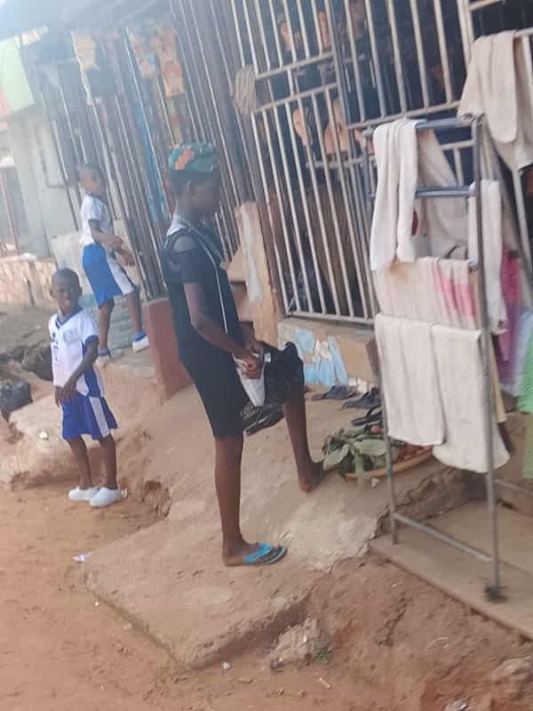 School children, families navigate dirt roads in Onitsha