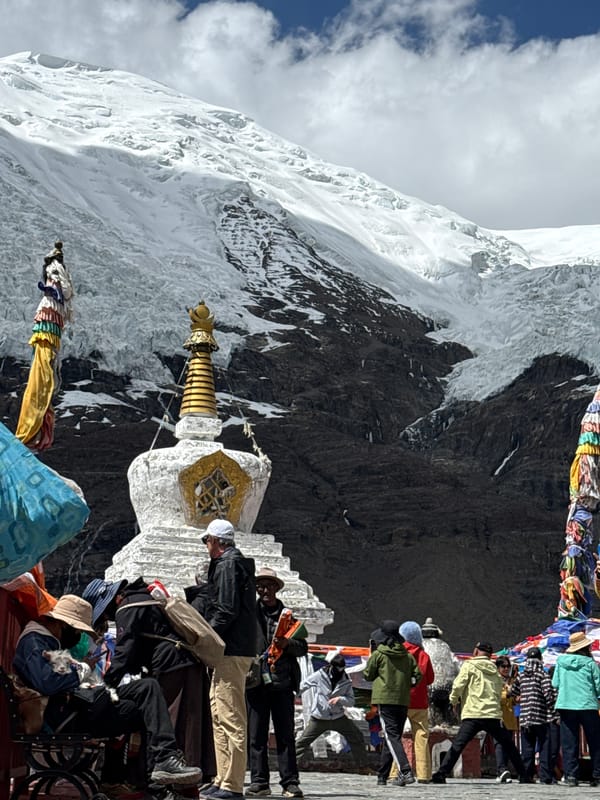 Buddhist stupa observed amid snowy mountains in Gyantse County