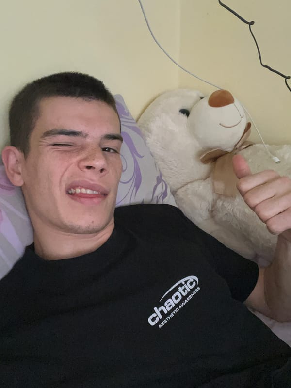 Young man takes selfies with teddy bear in Plovdiv bedroom