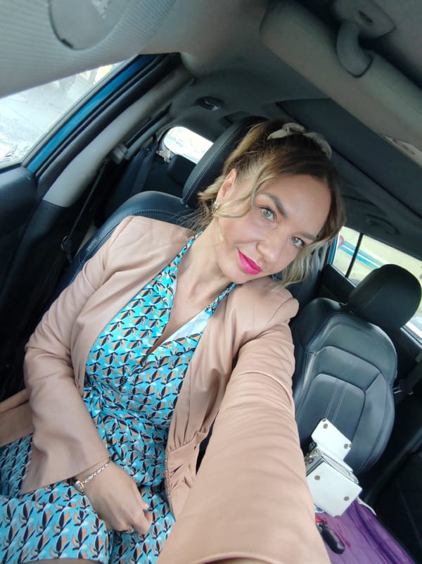 Woman takes selfies in car driver's seat in Kamchatka