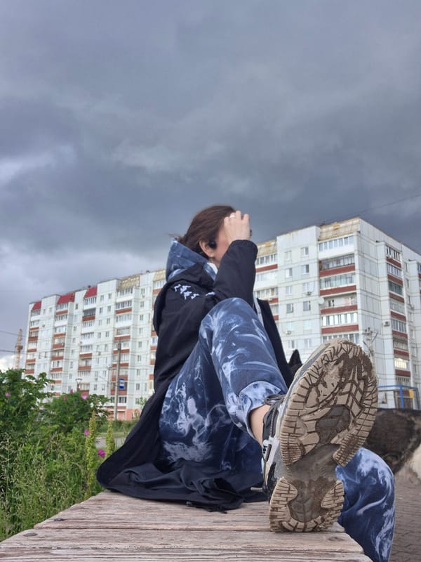 Ordinary afternoon moments captured under dramatic skies in Chaikovsky