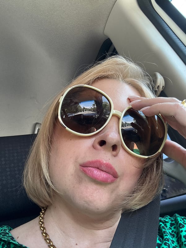 Car selfie in Sochi, sunglasses reflecting sky and trees